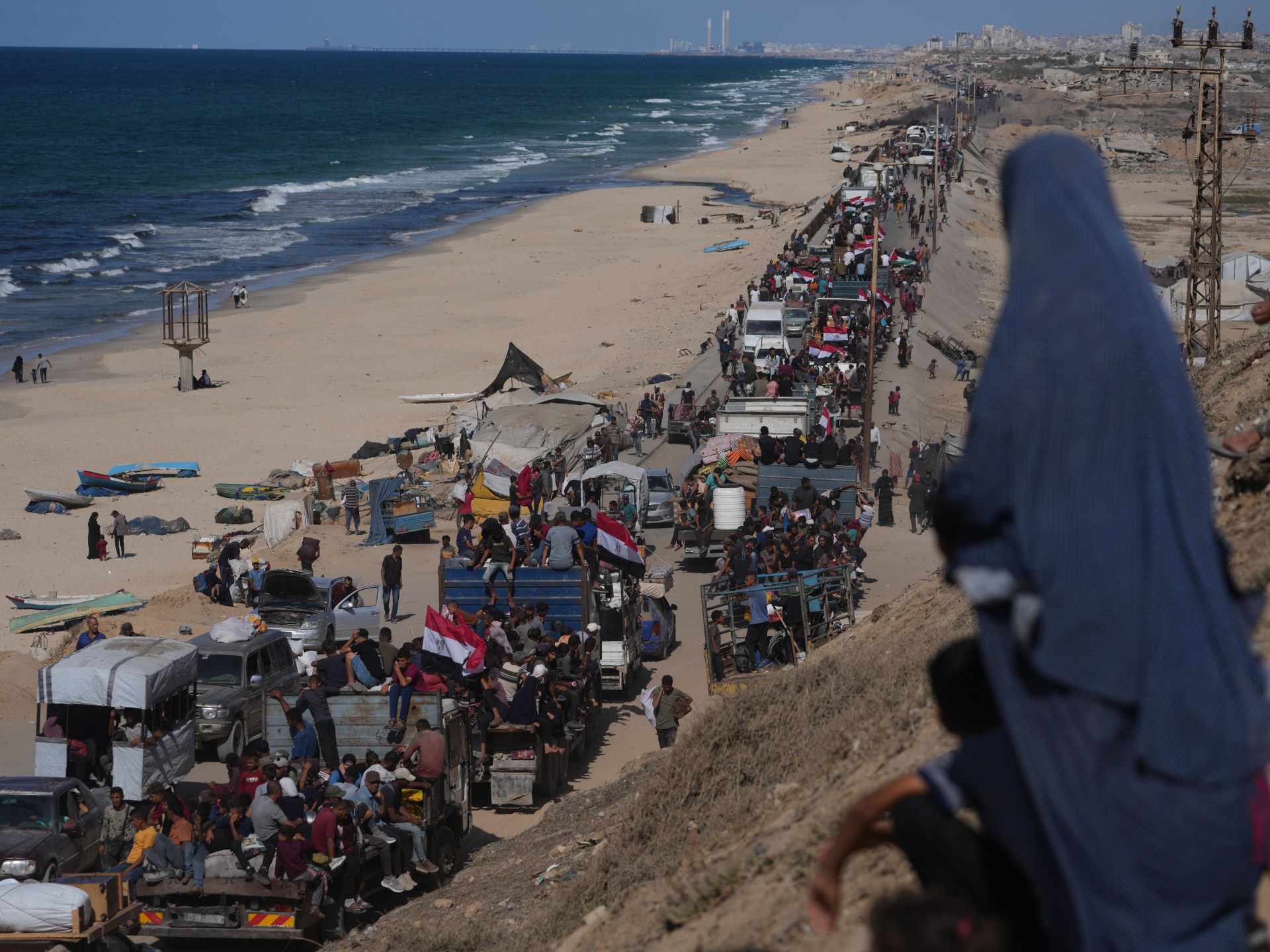 LIVE: Israel-Hamas truce holds, bulldozers clear rubble in Gaza City
