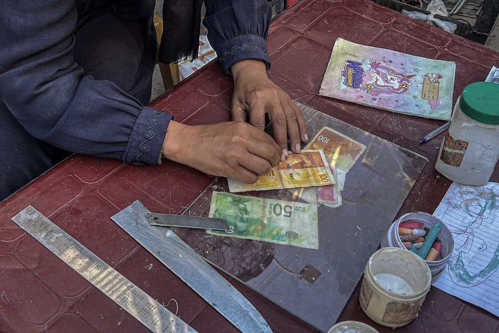 In Gaza, even cash comes at a cost